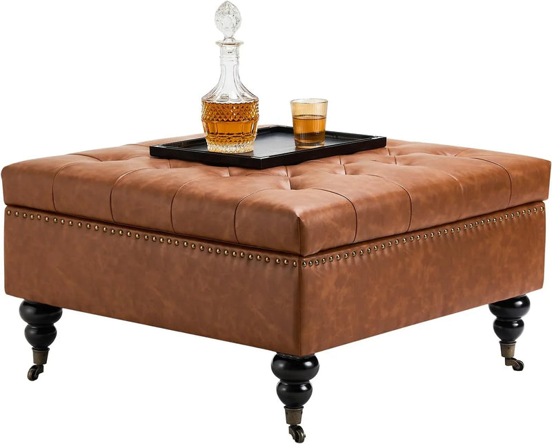 Square leather footstool with storage function, coffee table-style footstool with soft padded raised buttons, equipped with wheels, polyurethane leather high-density sponge, suitable for living room, dormitory, bedroom, in brown color scheme. E1